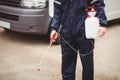 Handyman with insecticide Royalty Free Stock Photo