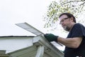 Handyman Installing Gutter Guards Royalty Free Stock Photo