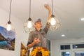 Handyman installing a smoke detector on the ceiling Royalty Free Stock Photo