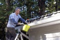 Handyman performing Home Maintenance - Royalty Free Stock Photo