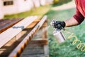 Handyman, male construction worker painting with spray gun on site Royalty Free Stock Photo