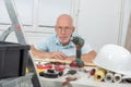 Handyman mature man with blue shirt, DIY at home