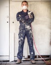 Handyman with paint sprayer