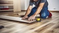 A Handyman Perfecting a Home with New Laminate Flooring