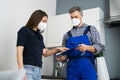 Handyman Plumber And Customer With Service Contract Royalty Free Stock Photo