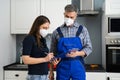 Handyman Plumber And Customer With Service Contract Royalty Free Stock Photo