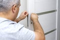man changing the door lock at home Royalty Free Stock Photo