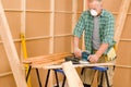 Handyman sanding wooden board diy home renovation Royalty Free Stock Photo