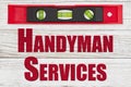 Handyman Services word message with red and black level