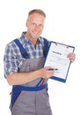 Handyman showing invoice on clipboard Royalty Free Stock Photo