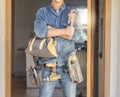 Handyman, tool bag and arms crossed at work with goals, property development and real estate maintenance. Construction