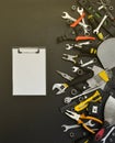 Handyman tool kit on black wooden table. Many wrenches and screwdrivers, pilers and other tools for any types of repair