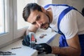 The handyman uses the level on the windowsill Royalty Free Stock Photo