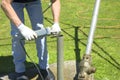 Handyman using grinding tool to repair