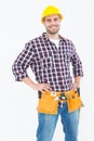 Handyman wearing tool belt while standing hands on hips Royalty Free Stock Photo