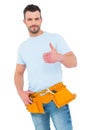 Handyman wearing tool belt with thumbs up Royalty Free Stock Photo