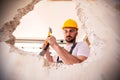 Handyman in yellow protective helmet