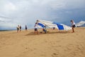 Hang glider flight check on sand dunes in North Carolina