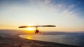 Hang-glider flight in sky in sunset time over the Kineret, Mevo Hama