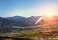 Hang-glider fly over mountain valley