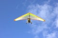 A hang glider is flying high in the sky. Royalty Free Stock Photo
