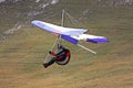 Hang glider pilot in Italian mountains