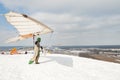 Hang glider pilot ready to fly from the hill Royalty Free Stock Photo