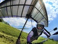 Hang glider pilot after take-off from a hill Royalty Free Stock Photo