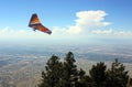 A Hang Glider Searches for Lift in the Sandia Mountains Over Albuquerque, NM Royalty Free Stock Photo