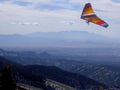 A Hang-Glider Soars the Sangre de Cristo Mountains in New Mexico Royalty Free Stock Photo