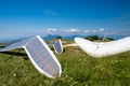 Hang gliders parked before taking a flight over the hills on a sunny day