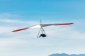 Hang gliding over valley farmlands and mountains Royalty Free Stock Photo