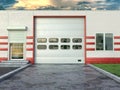 Hangar exterior with sectional gate.