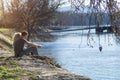 5.2019.Hangary .A young couple sits by the river .Relaxing by the river. love and people concept