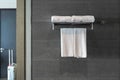 Hanger with clean towels on brick wall in bathroom Royalty Free Stock Photo