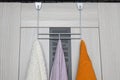 hanger on the door with towels hanging on it Royalty Free Stock Photo