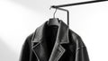 The hanger and rail have a sleek matte finish complementing the coat s style Royalty Free Stock Photo