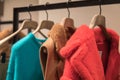 Hangers with autumn`s women`s  wear in shop. Royalty Free Stock Photo