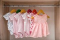 Hangers with baby clothes on rack Royalty Free Stock Photo