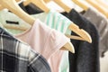 Hangers with woman clothes wardrobe. Royalty Free Stock Photo