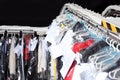 Hangers with clothes on conveyor at dry-cleaner`s