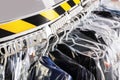 Hangers with clothes on garment conveyor at dry-cleaner`s