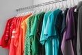 Hangers with different colorful clothes on rack Royalty Free Stock Photo