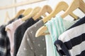 Hangers with woman clothes wardrobe. Royalty Free Stock Photo