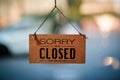 Hangging wooden sign sorry we are closed please come back again Royalty Free Stock Photo
