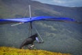 Hangglider take-off An athlete with a blue hang-glider prepares to start Royalty Free Stock Photo