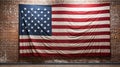 American flag hanging on red brick wall and white wall of a room. Hanging USA flag on red wall Royalty Free Stock Photo