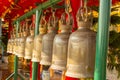 Hanging bell. Large black bell hanging in rows on a steel beam.Thailand