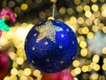 Hanging Blue Gillter Christmas Ball On Christmas Bokeh Lights Blurred Background