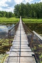 Hanging bridge. Bridge goes over river